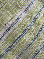 close-up of handwoven, naturally dyed table runner