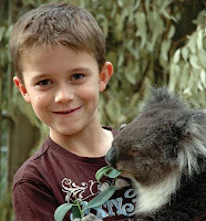 NAMC montessori elementary developing independence movement motor skills boy and koala