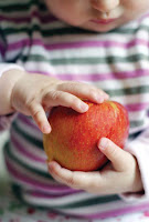 NAMC montessori math materials curriculum explained all ages girl with apple