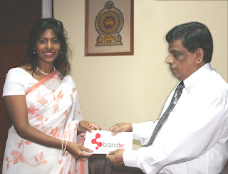Picture shows Ms Aroshi Perera, Head of Risk & Control at Brandix Lanka Limited presenting the sponsorship agreement to Mr Mahinda Madihahewa , Secretary to the Ministry of Labour Relations & Manpower.