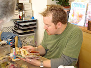 Tim looking at Lindas fat book page