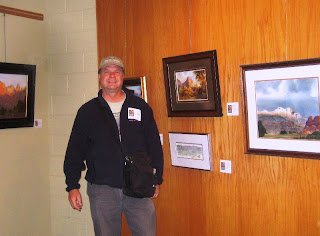 Roland Lee with his painting of the Watchman in Zion National Park