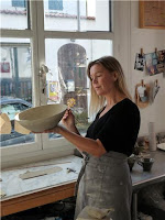 Lena Balthazard working with pottery