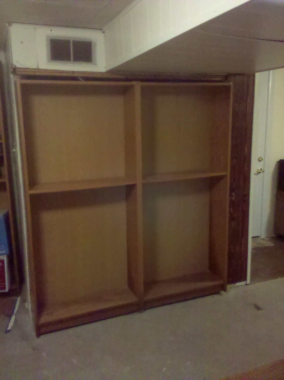 Billy Bookcase door hides furnace or closet or secret room. IKEA