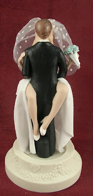 caketopper of bride and groom having sex