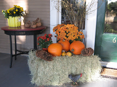  mums and hay bales The colors are great and the porch looks so cheerful 