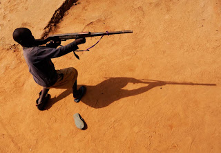 A child soldier in northern Uganda. Photo by Jon Warren, copyright 2008 World Vision.