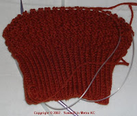 half done waffle-weave cap in rust