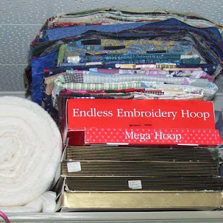 They're piling up! Quilt tops waiting to be quilted.