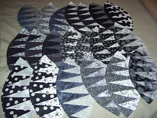 21 paper-pieced football shapes completed so far.