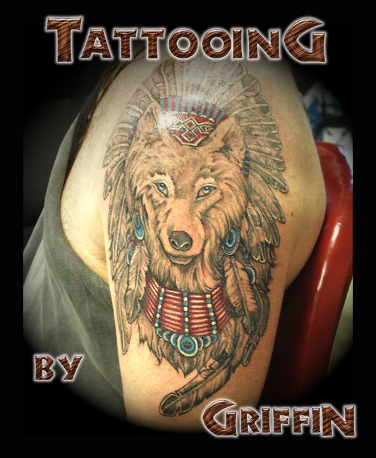 This looks like the king of all wolf tattoos. The image of a somewhat docile This looks like the king of all wolf tattoos. The image of a somewhat docile
