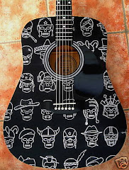 HEITIARE'S FIRST GUITAR. SHE HAD THOSE DESIGNS PAINTED ON IT ON HER REQUEST. IT REALLY LOOKS COOL!