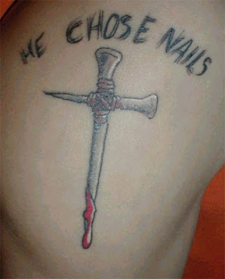 nail cross tattoo. nails tattoo