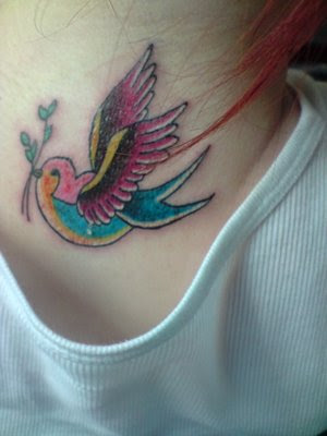 Colorful swallow tattoo