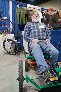 Ted Wojcik on the pedal powered lawn mower made for my brother Matt