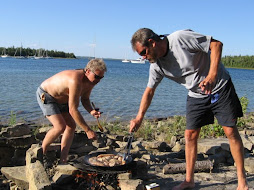 cooking paella over an open wood fire