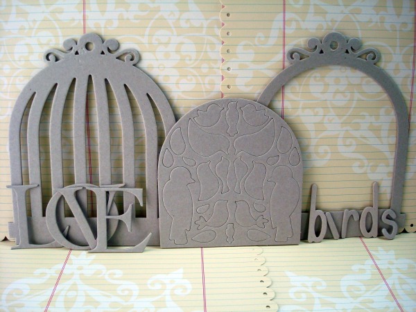 The project also features parts of a wonderful chipboard birdcage book from