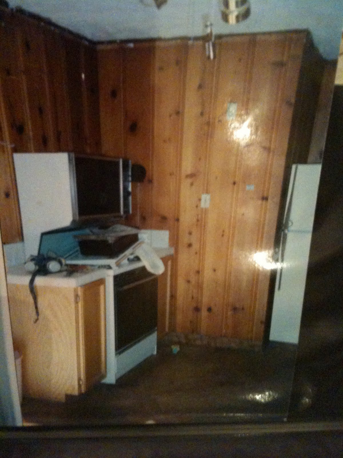Unfinished pine kitchen cabinets There was a hole in the wall next to the stove where an old pipe used