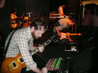 Mae guitarists Zach Gehring and Dave Elkins adjust their effects pedals.