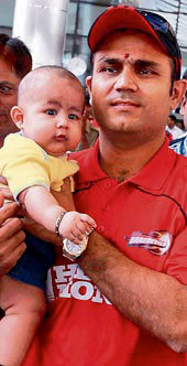 Sehwag with his son