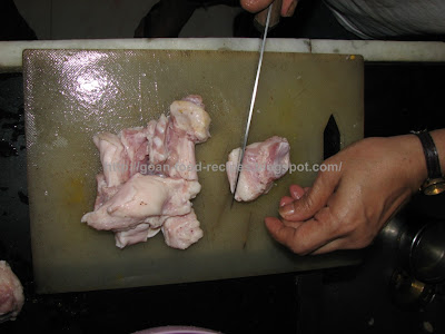 Clean and chop the pork pieces