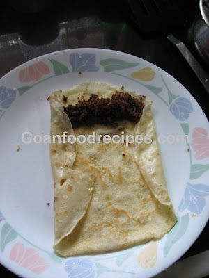 Fold the sides of the pancake after adding some filling to it