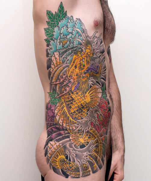 This amazing side tattoo combines the traditional Japanese koi with a dragon