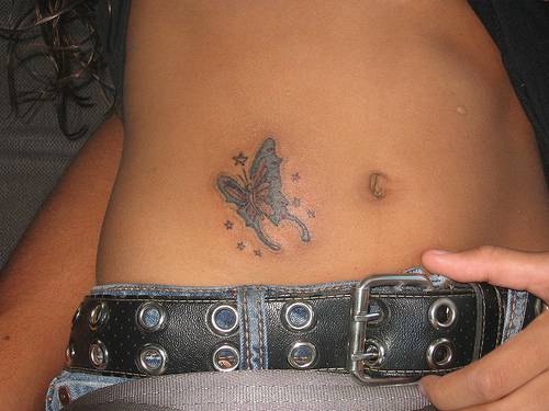hello kitty tattoo for lowerback girls. small butterfly for back ear girls