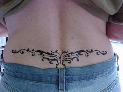 Perfect Sexy Girl With Tribal Butterfly Tattoo On The Lower Back
