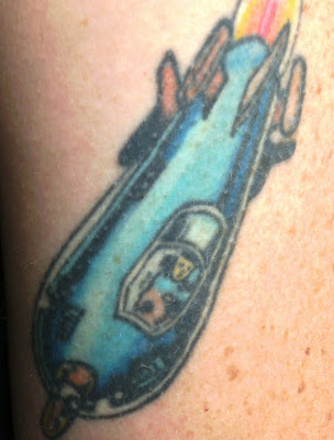 The tattoo represents Superman as a child fleeing the exploding planet of