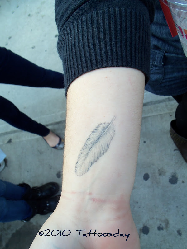 This white feather on the inside of her right wrist is tied to the  title=