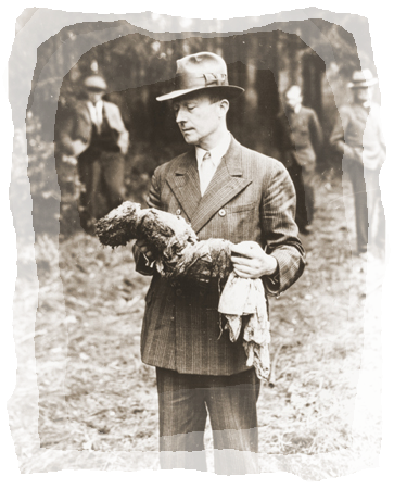 [German_man_holding_exhumed_baby_from_a_mass_grave_outside_the_town_of_Suttrop.png]