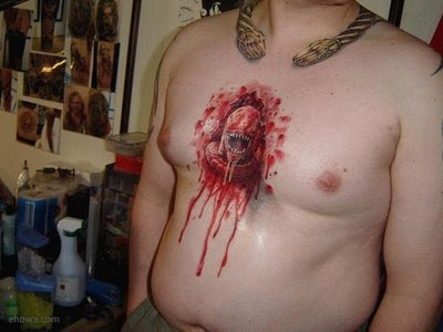 tattoos for men on chest words. Extreme Tattoos | Alien Spawn Tattoo Breaking Out of Man's Chest