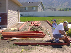 Spencer helping Jay build our garden box