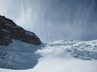 Skiers negotiating poor snow on the Ingraham Direct.