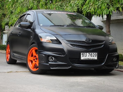 Toyota Yaris flat black orange wheels