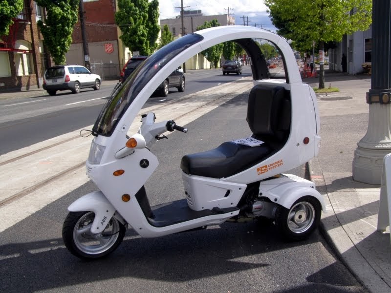What the hell? Covered threewheeled scooter is "that guy" on the