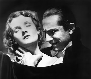 Mina (Helen Chandler) as she is about to receive the kiss of undeath from Dracula (Bela Lugosi)