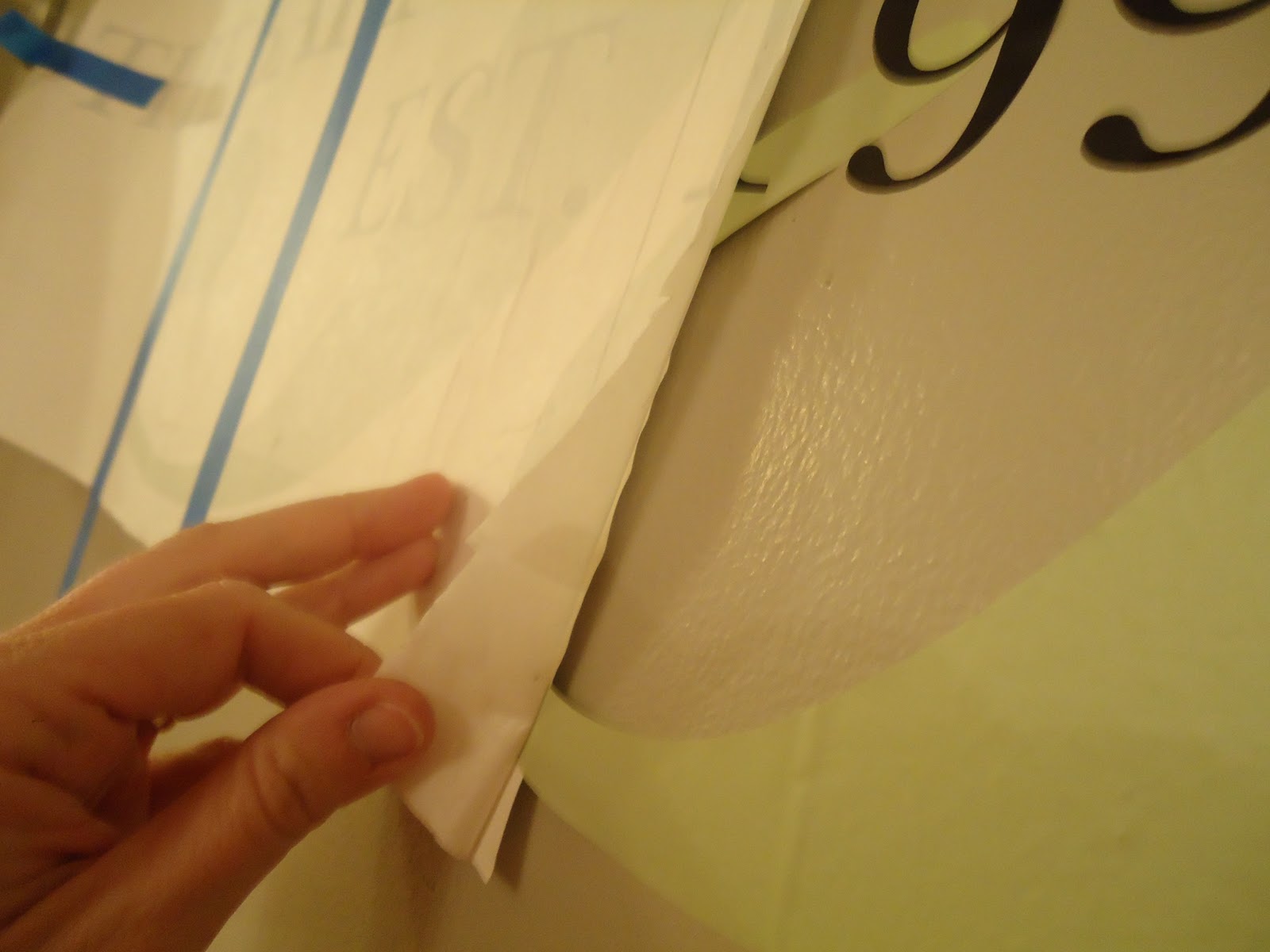 That bare wall in the kitchen how to hang a large decal! Organizing