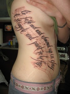 writing tattoos on ribs