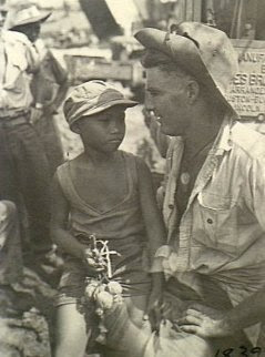 Philippines People Filipino Pinoy Pilipinas Old Black White Pictures boy sits on soldier lap 2 December 1944 leyte noon