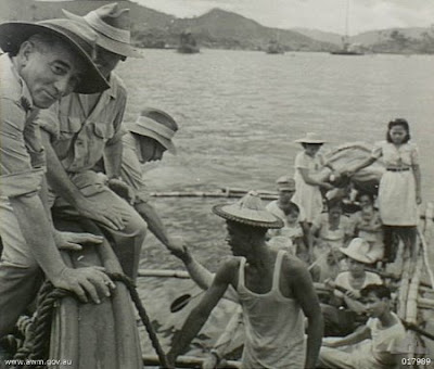 Philippines People Filipino Pinoy Pilipinas Old Black White Pictures christmas day festive ship australian soldiers boaat banca leyte tug noon