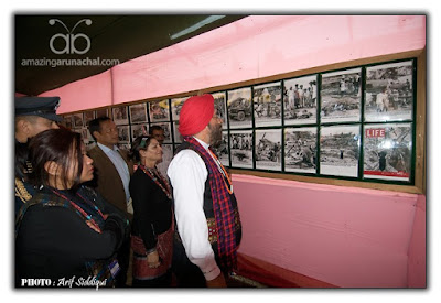 Retd. General of Army admiring the rare collection of WWII photographs