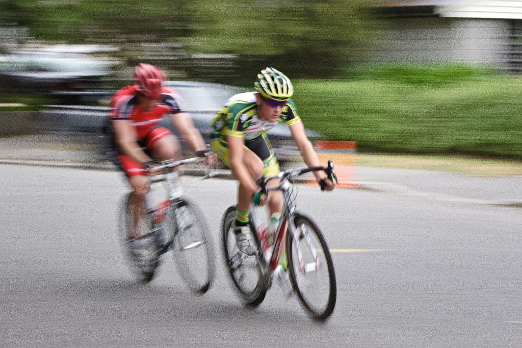 Michael Vink, in the green and yellow, speeds past  