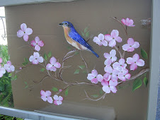 Blue Bird on Dogwood Branch on window