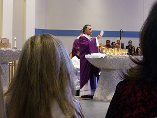 Cardinal DiNardo blessing the Host