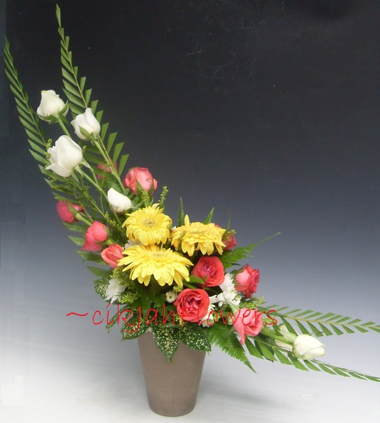 .. Crescent Shaped Floral Arrangement
