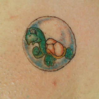 Small cartoon turtle in bubble tattoo. Small cartoon turtle in bubble tattoo.