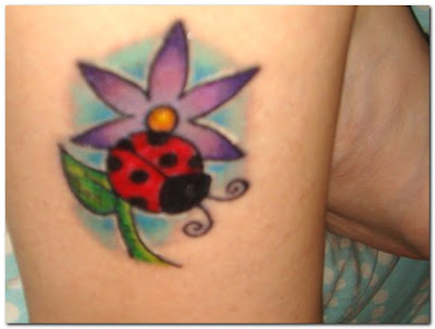 Flower and ladybug tattoo. Flower and ladybug tattoo.