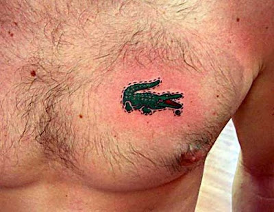 Small Alligator tattoo on chest.
